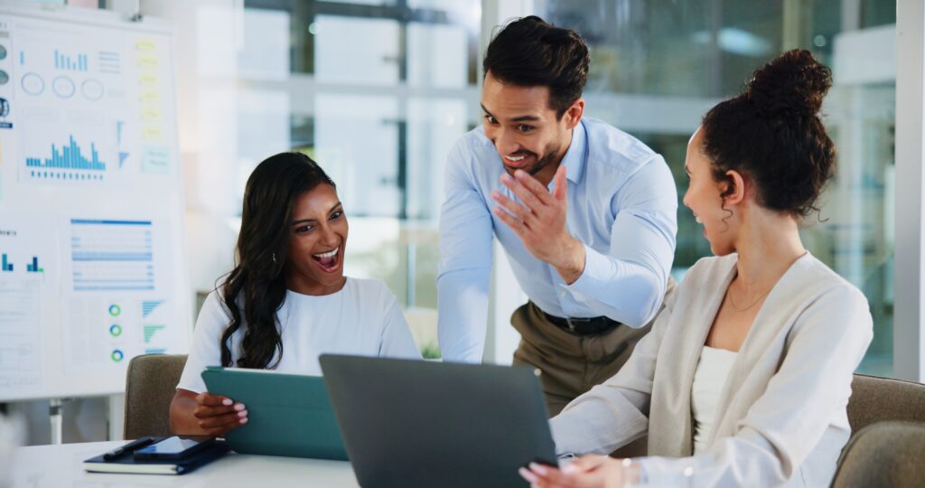 Employees having a meeting about their sales performance.