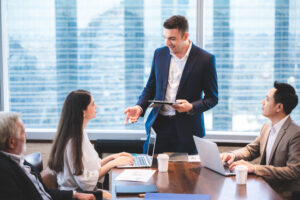 Team meeting led by a manager offering guidance and leadership.