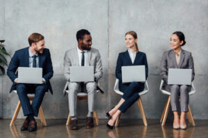 Young professionals exploring entry-level jobs in a modern setting.