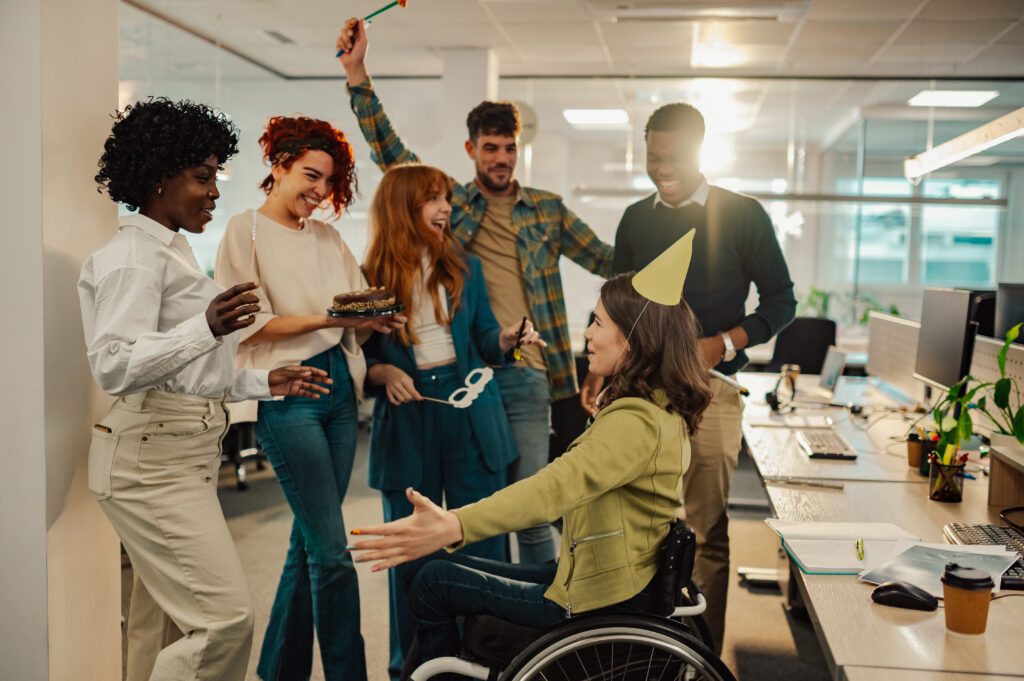 Employees enjoying a workplace celebration that highlights a positive work culture.